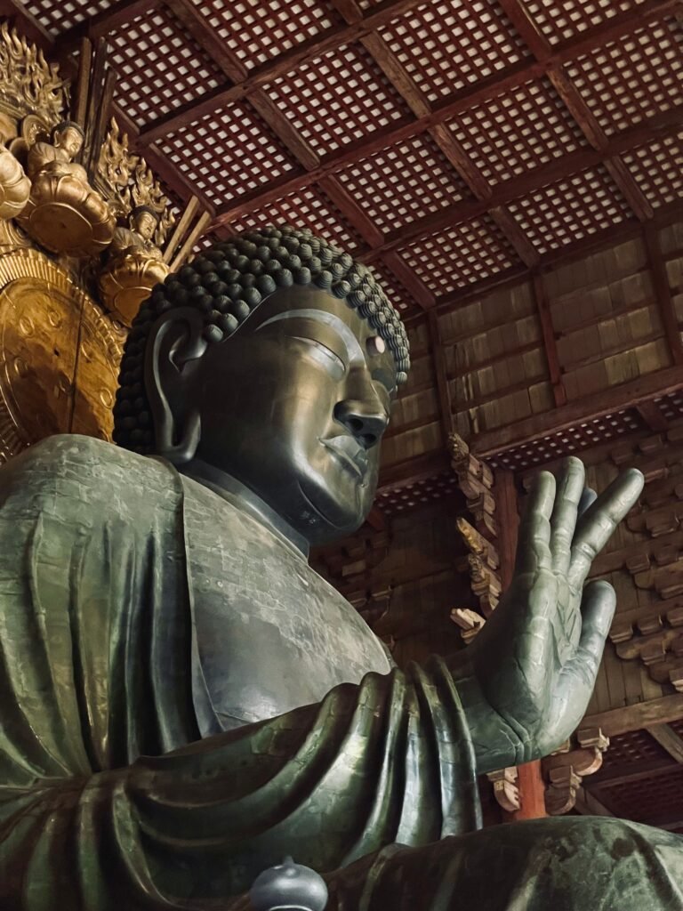 Bronze Buddha statue in Todaiji Temple, a symbol of Buddhism in Nara, Japan.