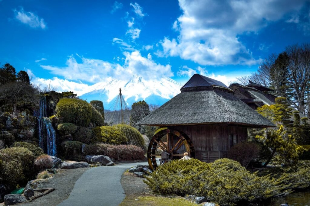 Serene view of a traditional Japanese house with Mt. Fuji in the background, embodying nature and culture.