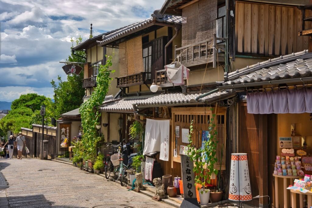 Charming traditional street in Kyoto, Japan featuring historic wooden houses and local shops.