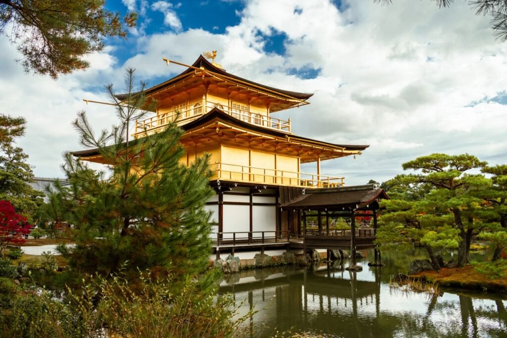 Scenic view of Kinkaku-ji, the Golden Pavilion in Kyoto, Japan surrounded by tranquil gardens.