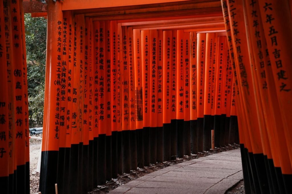 Majestic view of the iconic Torii gates at Fushimi Inari Taisha shrine in Kyoto, Japan.